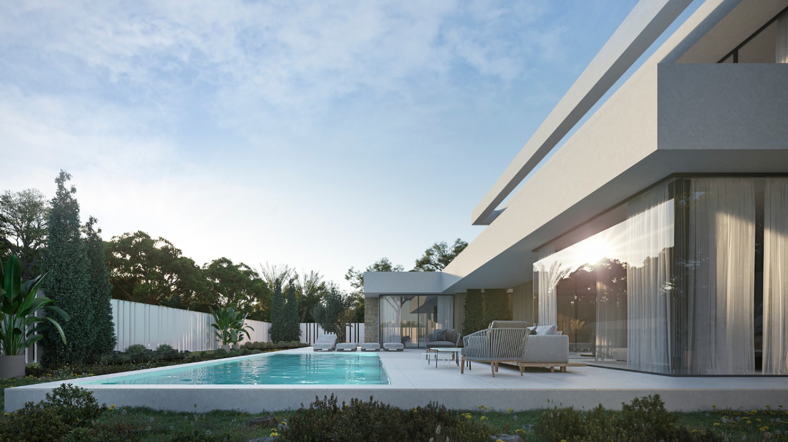 Modern villa exterior with a rectangular pool, stone terrace featuring lounge seating, and minimalist white architecture with large glass facades.