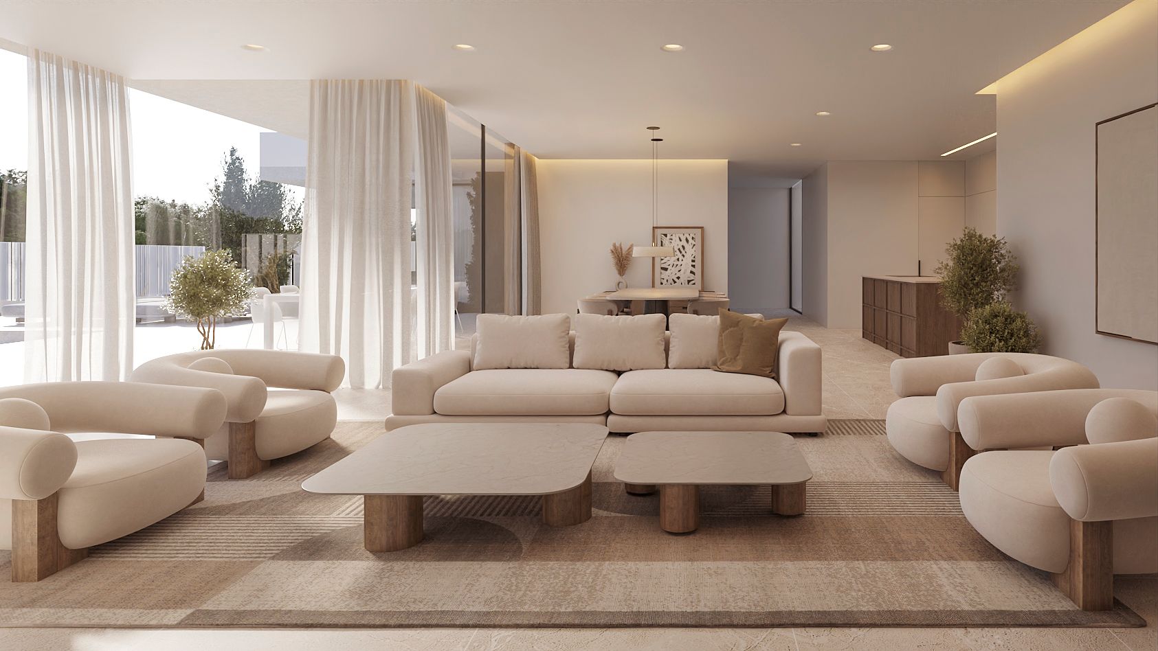 Spacious living area featuring curved cream seating, stone coffee tables, and floor-to-ceiling windows with sheer curtains opening to a garden.
