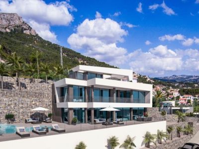 Exterior view of the villa featuring an infinity pool and sundeck, surrounded by Mediterranean greenery.