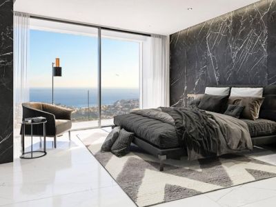Master bedroom with marble accent wall, double bed, and panoramic views of the Mediterranean Sea.