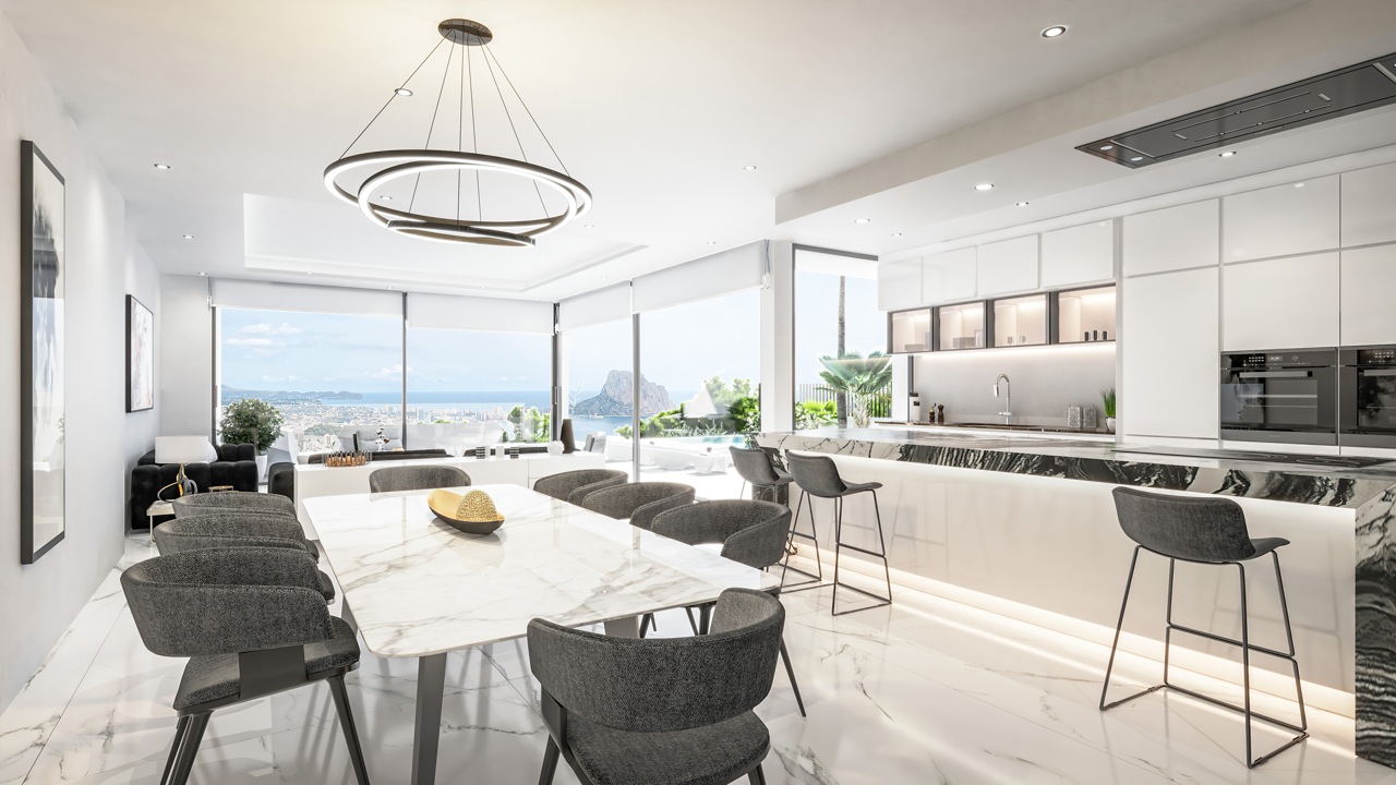 Dining area featuring a marble table and open kitchen with dark stone countertop.
