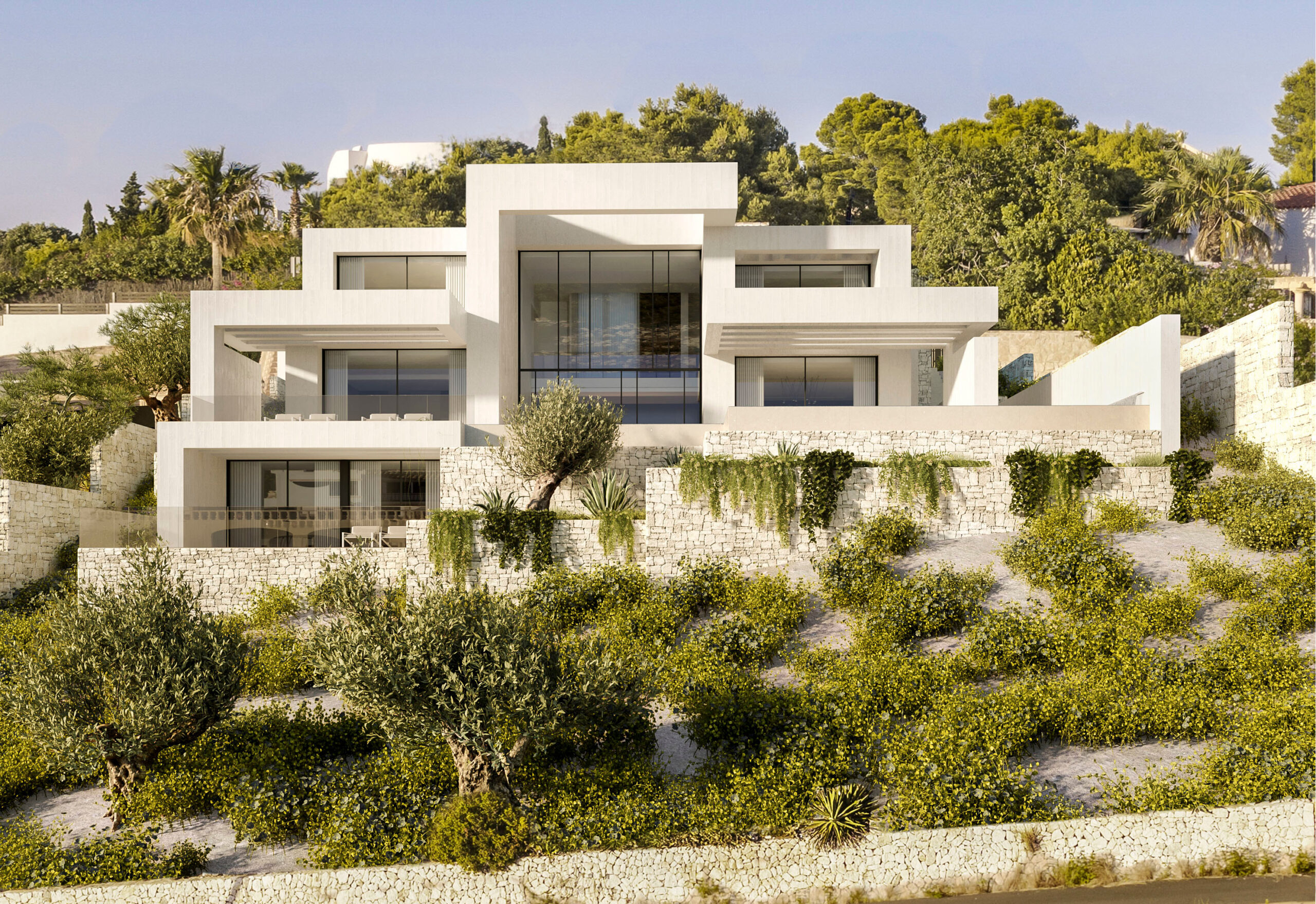 Modern multi-level villa exterior featuring white geometric lines, natural stone retaining walls, and floor-to-ceiling glass windows overlooking Mediterranean greenery.