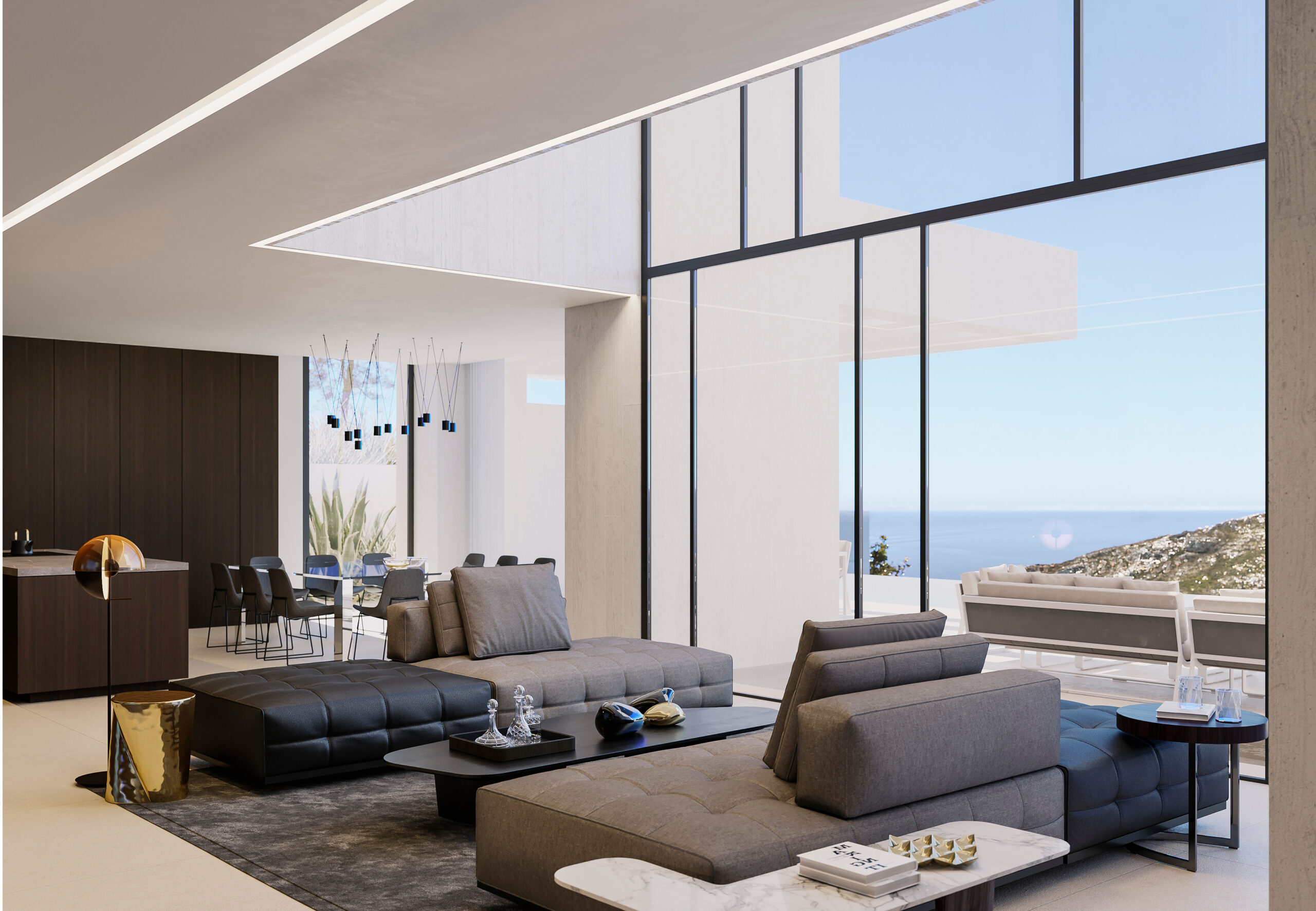 Open-plan living area featuring modular sofas, floor-to-ceiling glazing with sea views, and double-height ceilings with integrated linear LED lighting.