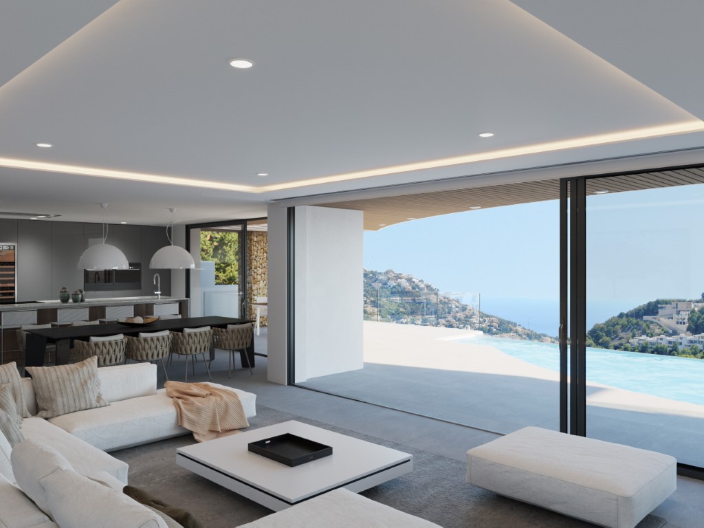 Open-plan living space with large sliding glass doors leading to a terrace and infinity pool, featuring panoramic views of the Mediterranean coastline.