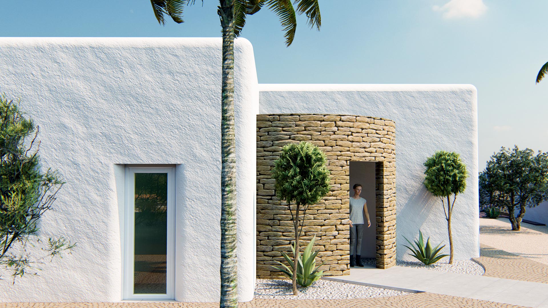 Ibicencan-style exterior featuring textured white walls and a cylindrical natural stone entrance, complemented by Mediterranean landscaping and palm trees.