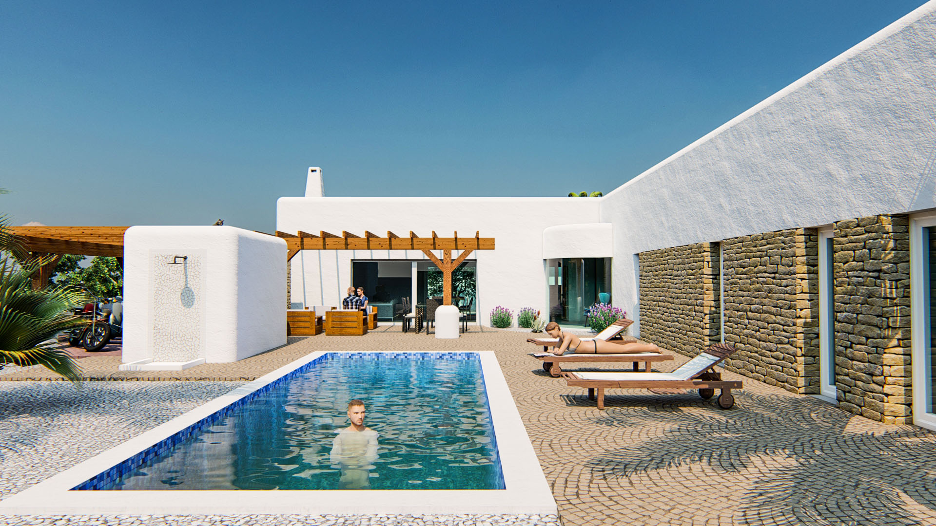 Ibizan-style exterior featuring a rectangular pool, cobblestone terrace, outdoor shower, and a facade blending white plaster with natural stone walls.