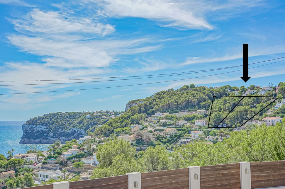 Elevated panoramic view showing the specific plot locations on the wooded hillside, overlooking the Mediterranean Sea and the rugged coastline of Jávea.