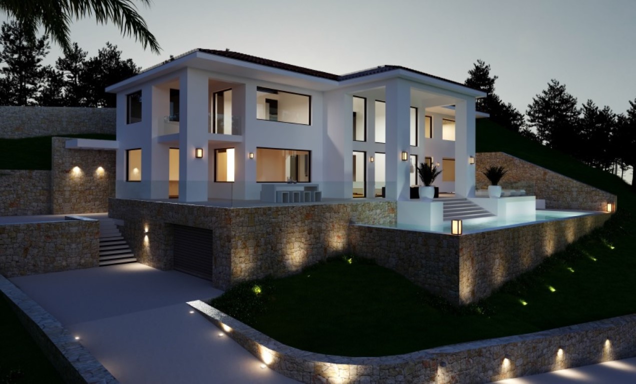 Evening exterior view featuring the white facade, natural stone retaining walls, an illuminated infinity pool, and integrated garage access.