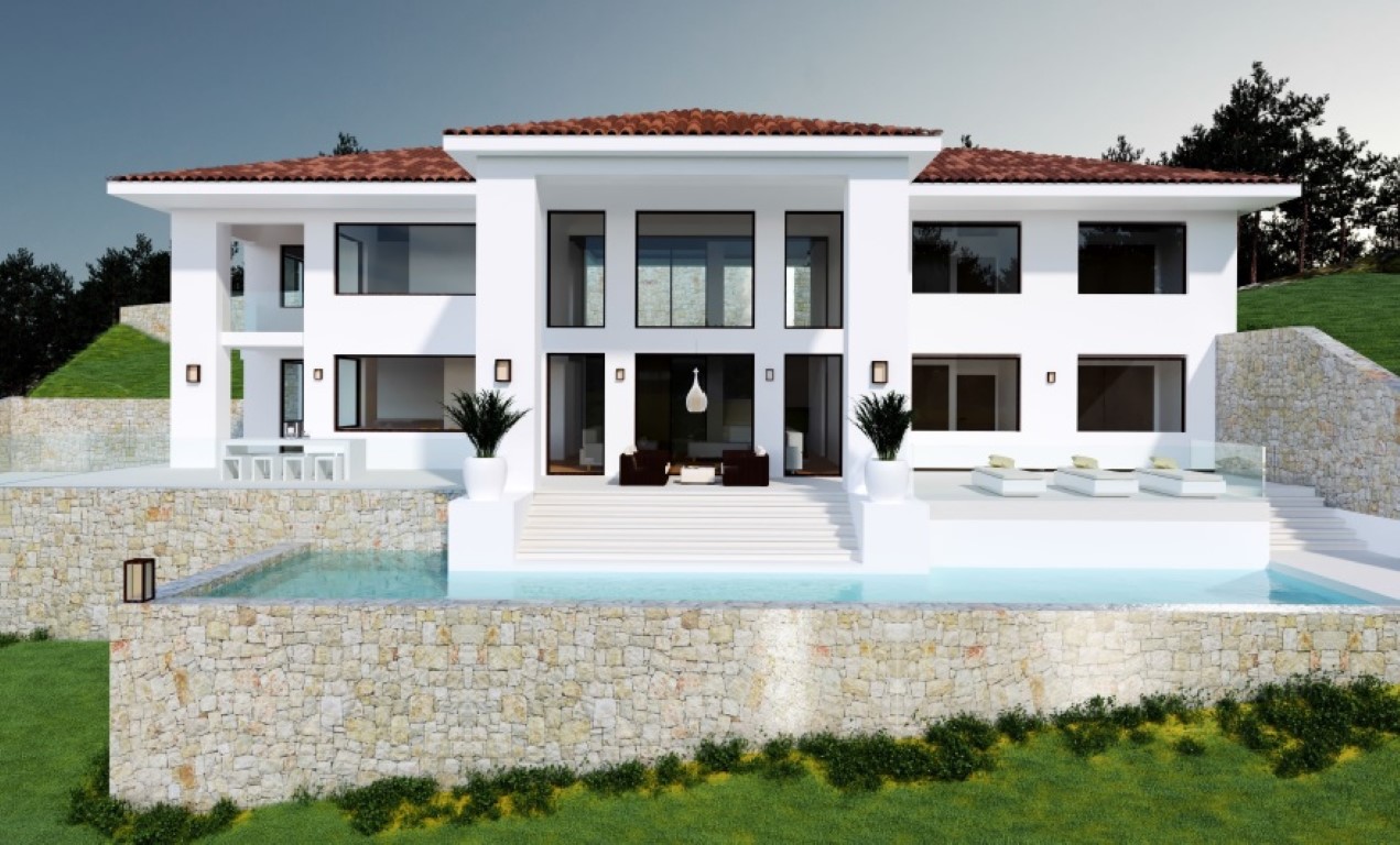 Modern white villa featuring expansive glass windows, an infinity pool framed by natural stone walls, and multiple terrace levels for lounging and dining.