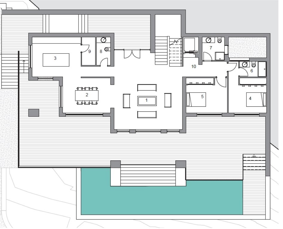 Technical floor plan of the main level showing the open living-dining area, kitchen, two en-suite bedrooms, and a large terrace with a swimming pool.