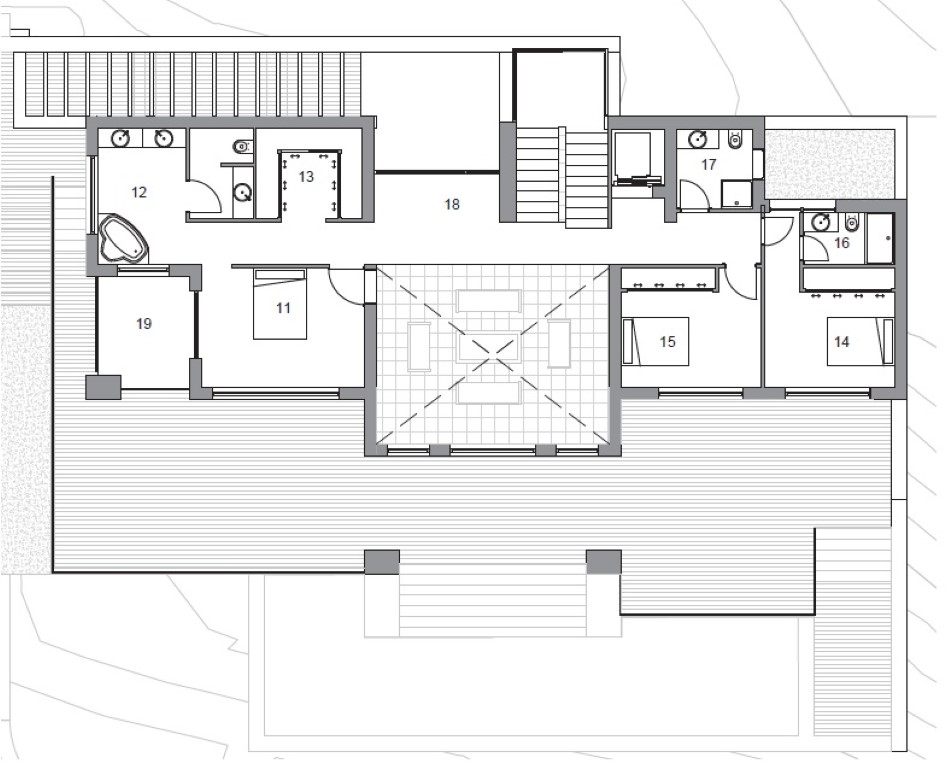 Technical floor plan of the upper level showing the master suite with dressing room, two en-suite bedrooms, and an expansive wrap-around terrace.