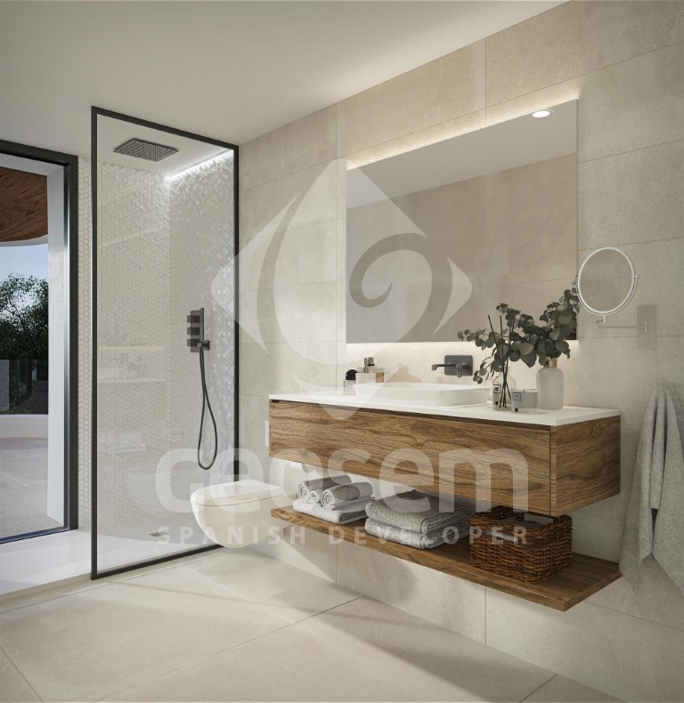 Contemporary bathroom with a floating wooden vanity, backlit mirror, and walk-in shower featuring black profiles and neutral-toned tiling.