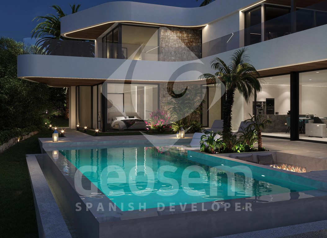 Night view of the infinity pool and sunken fire pit area. The modern facade features curved lines, natural stone walls, and integrated LED lighting under the eaves.