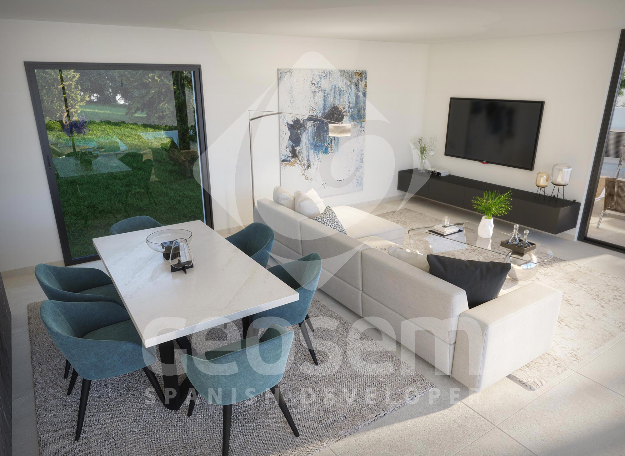 Open-plan living and dining area featuring a white stone table with teal chairs and a large L-shaped sofa. Floor-to-ceiling glass doors offer direct access to the garden.