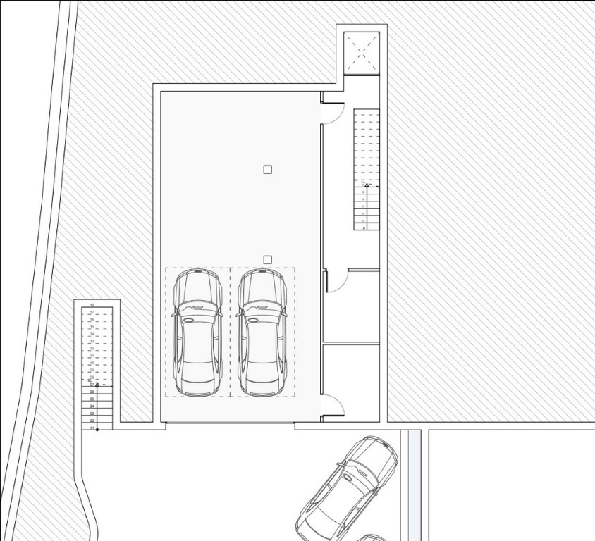 Technical floor plan of the garage level featuring multi-car parking spaces, elevator access, and an internal staircase connecting to the upper floors.