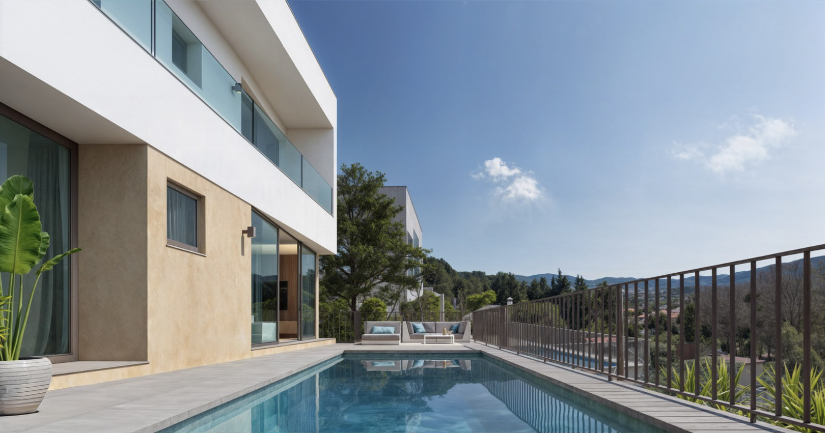 Modern villa exterior featuring a rectangular swimming pool, stone-tiled terrace, and glass-railed balconies with panoramic views of the mountains.