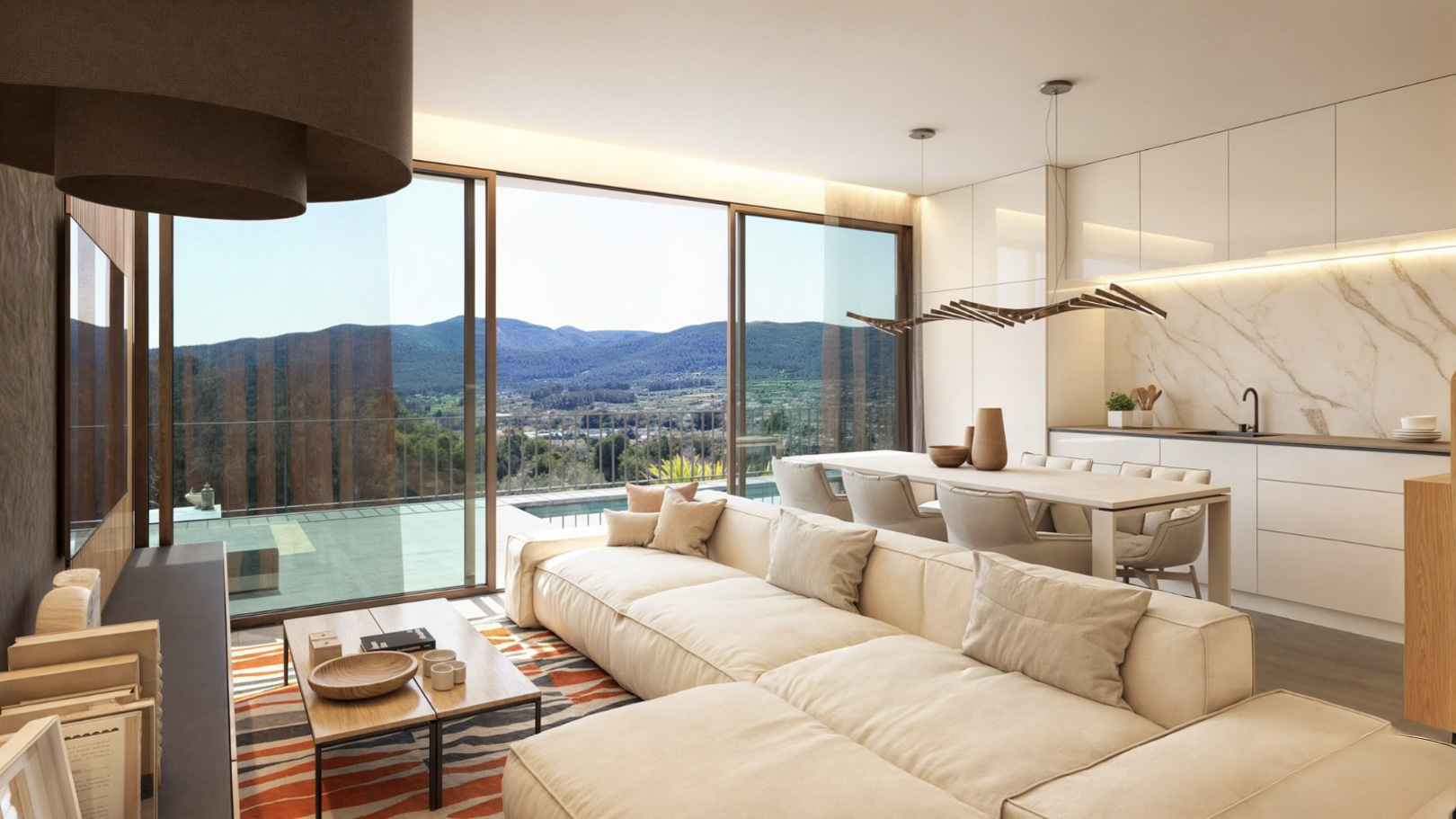 Open-plan living and dining area featuring a modern kitchen, large sliding glass doors, and panoramic mountain views of the Pop Valley.