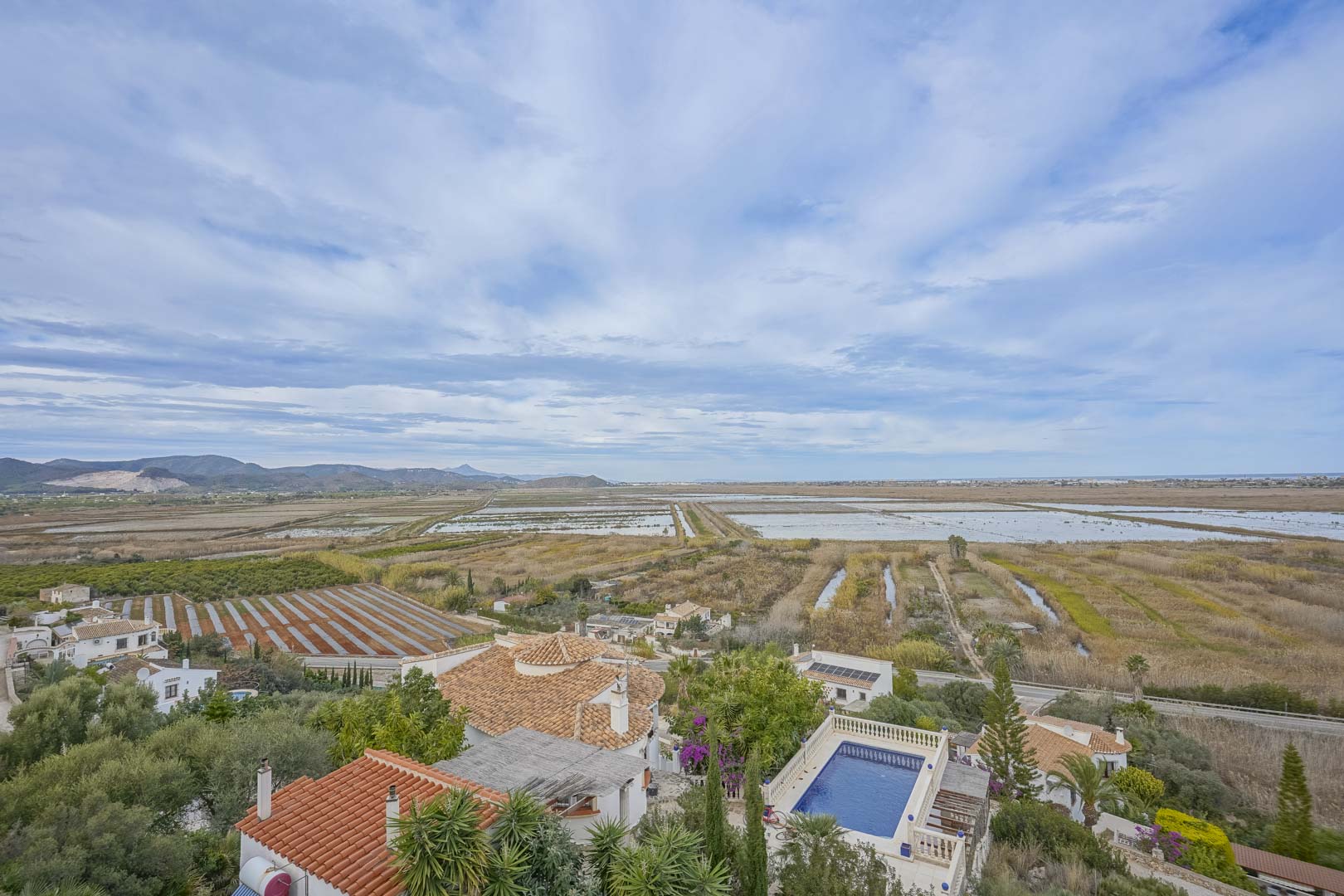 Panoramic view of the villa with pool and rice fields in Monte Pego.