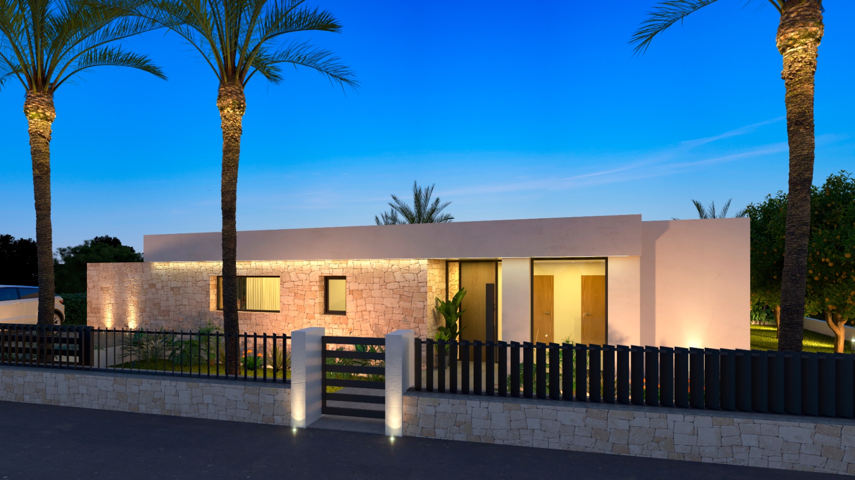 Illuminated villa facade, featuring natural stone cladding and a wooden entrance door.