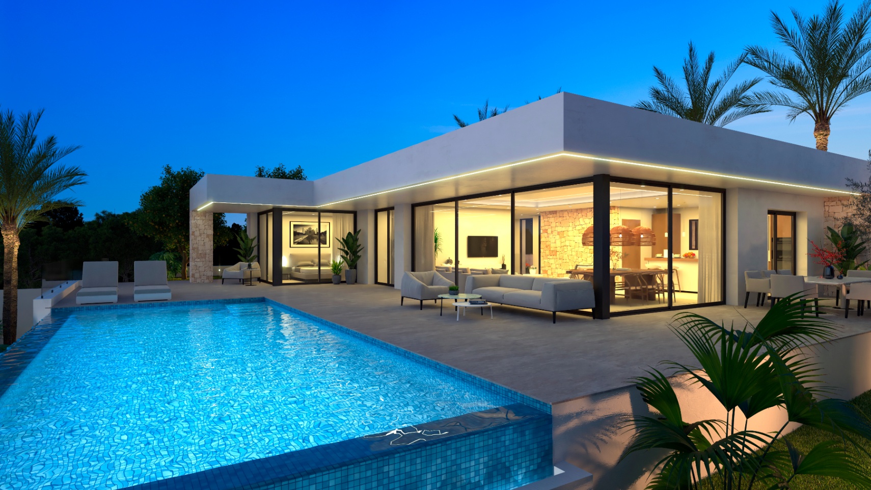 Night view of the villa featuring a blue mosaic pool and a terrace with modern furniture.