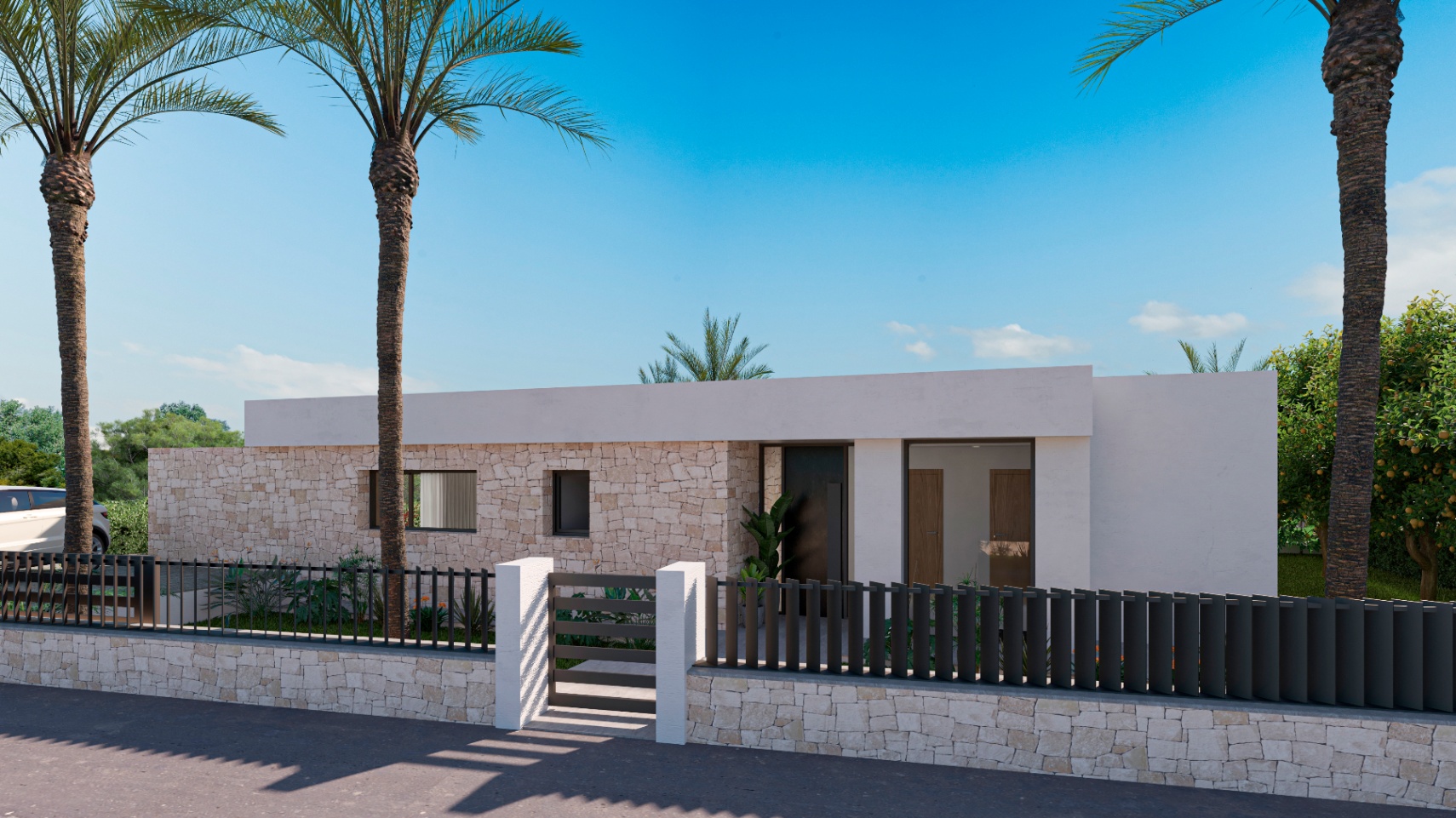 Villa facade featuring stone walls and a black metal fence.