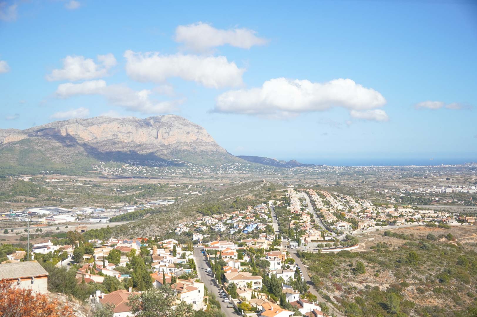 Panoramic view from the property overlooking the valley, featuring the majestic mountain range and the Mediterranean Sea on the horizon.