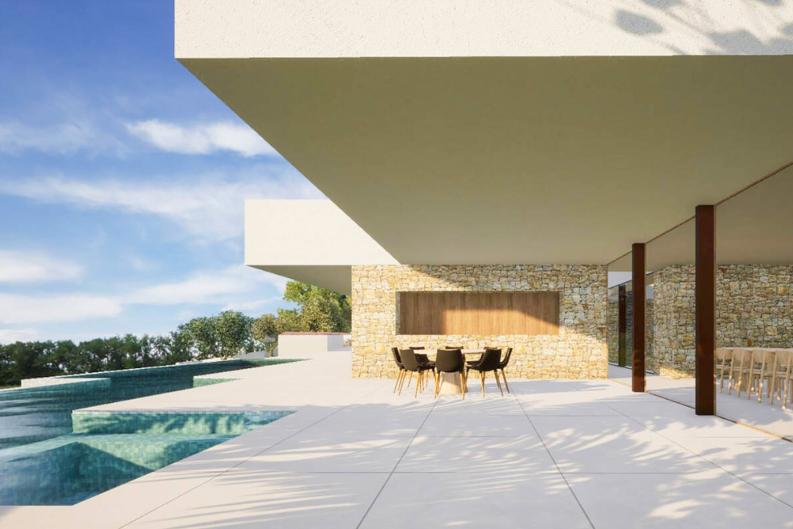 Exterior terrace featuring natural stone walls, large-format tiling, and a shaded dining area beneath a modern cantilever, adjacent to the turquoise infinity pool.