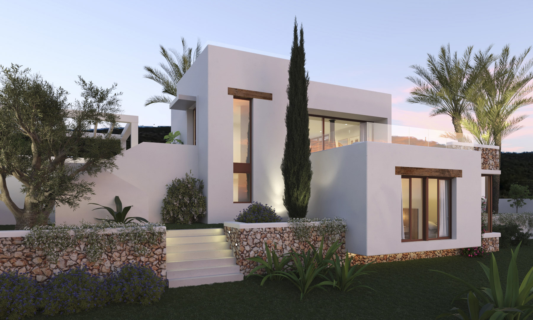 Ibizan-style facade featuring dry stone walls, wooden lintels, and an illuminated exterior staircase connecting the levels of the Mediterranean garden.