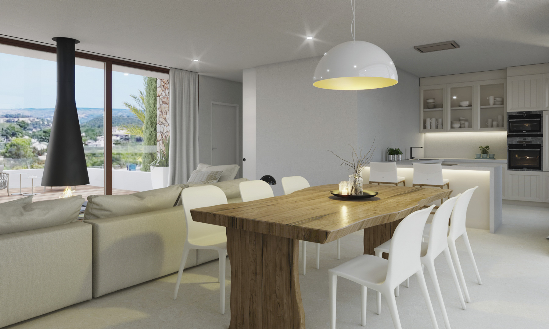 Open-plan living space featuring a solid wood dining table, a modern suspended fireplace, and a designer kitchen with views of the Montgó mountain.