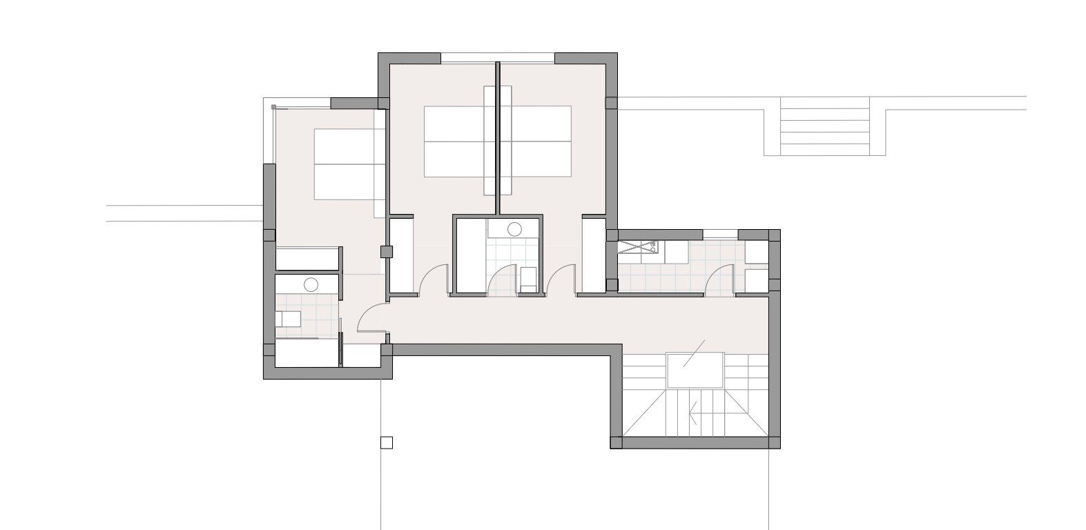 Technical floor plan of the lower level illustrating the layout of three double bedrooms, two bathrooms, and a dedicated laundry area.