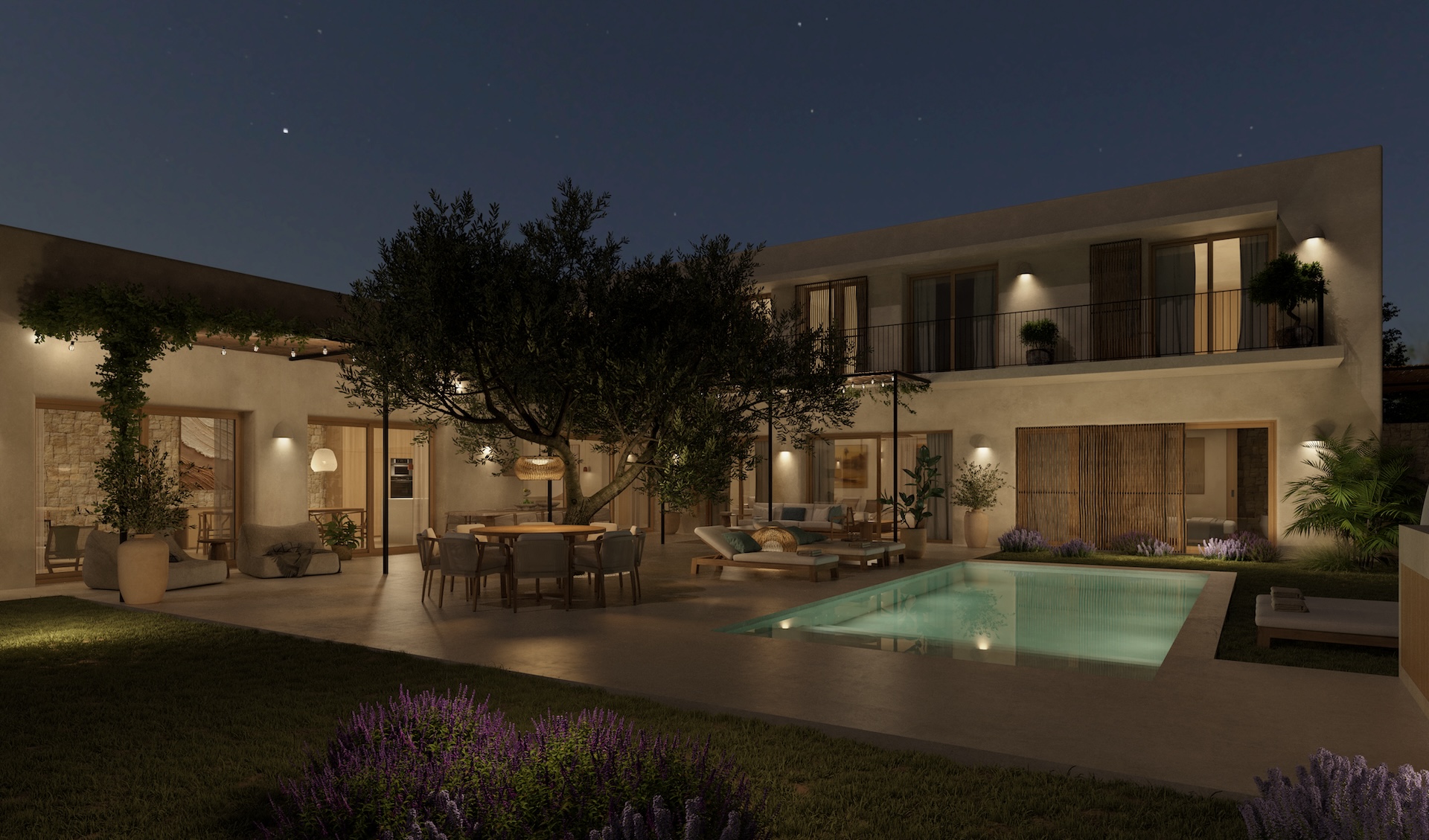 Night view of the courtyard featuring an illuminated pool, outdoor dining under a tree, and villa facade with balconies.