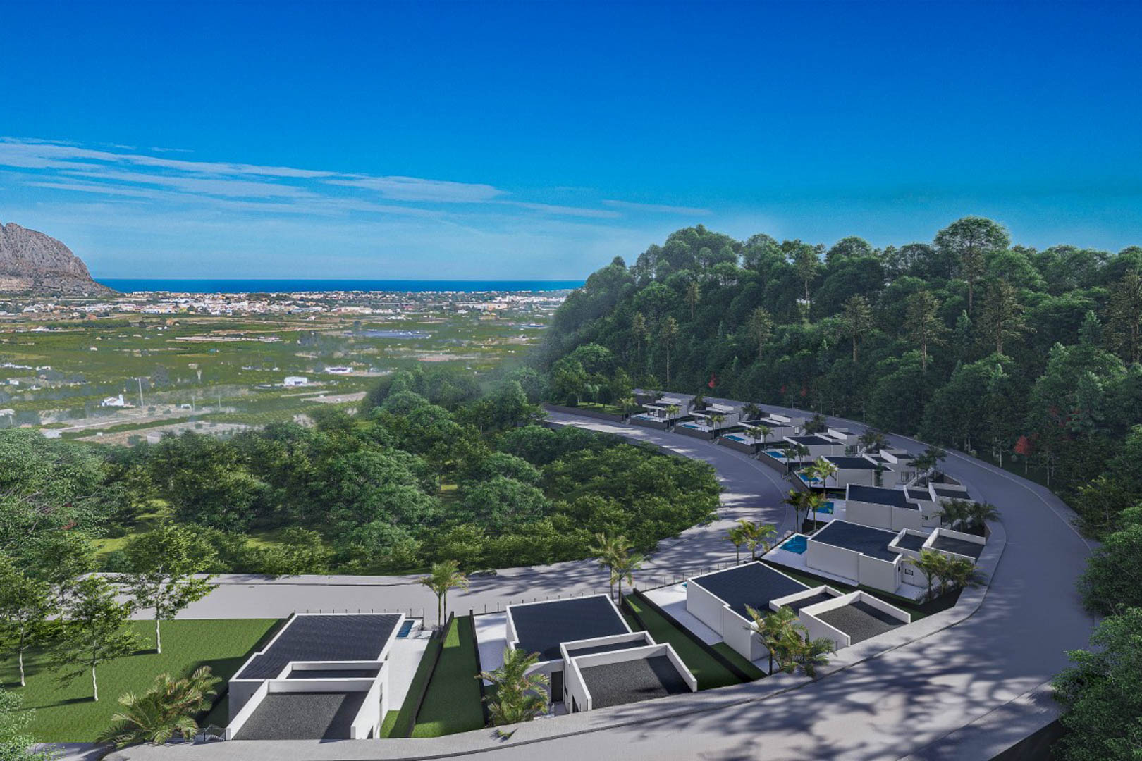 Aerial view of the modern villa complex in Monte Solana, featuring contemporary architecture nestled in a hillside with panoramic valley and sea views.