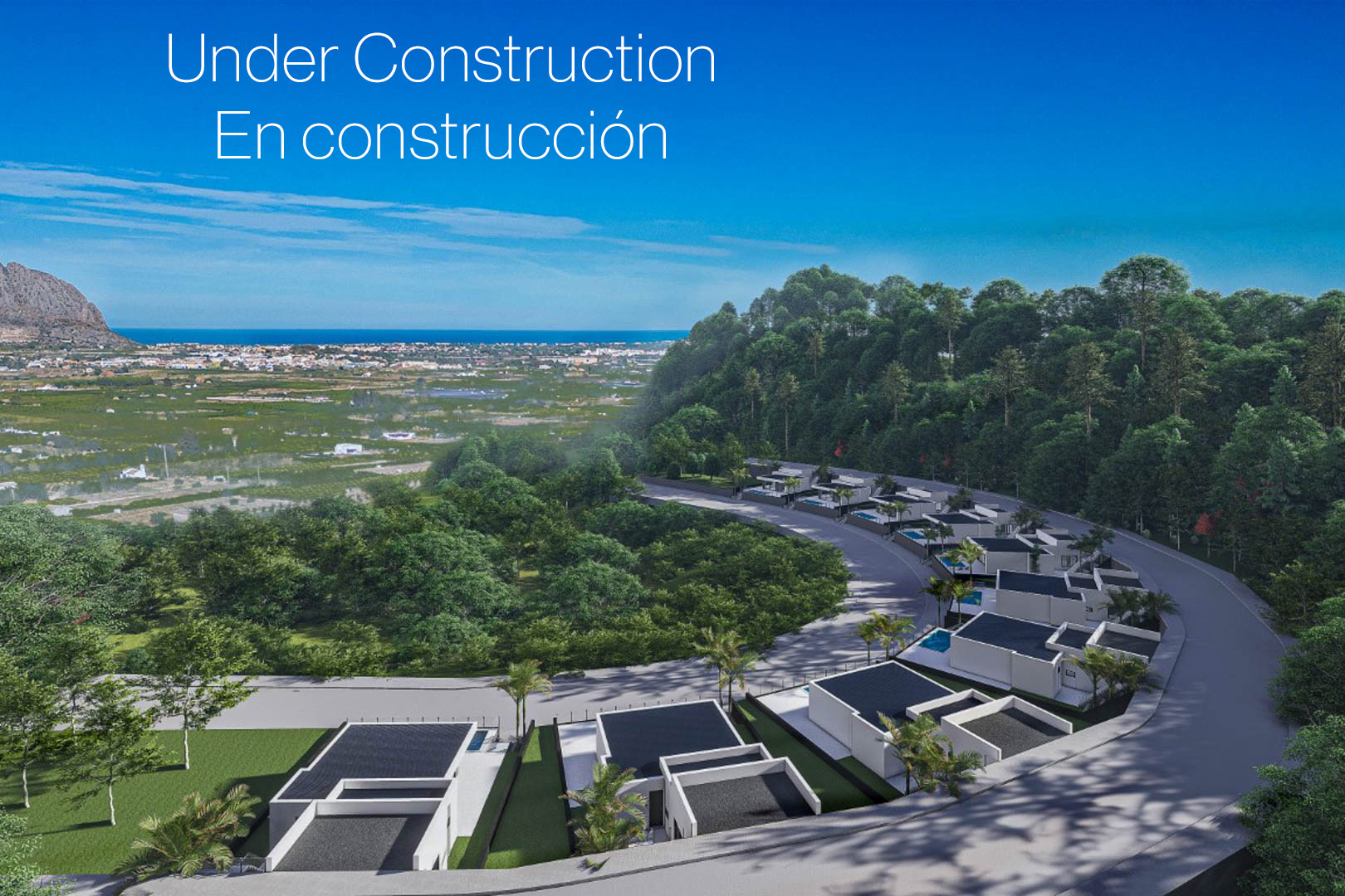 Aerial view of the residential development in Monte Solana, featuring modern villas along a curved road with panoramic valley and Mediterranean Sea views.