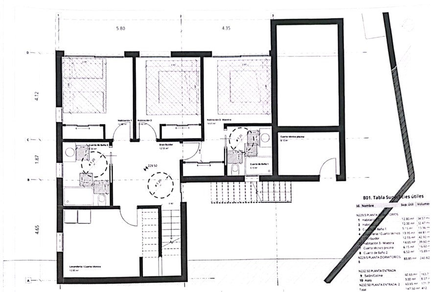 Detailed technical floor plan of the bedroom level, illustrating the layout of the bedrooms, bathrooms, laundry room, and a table of useful surface areas.