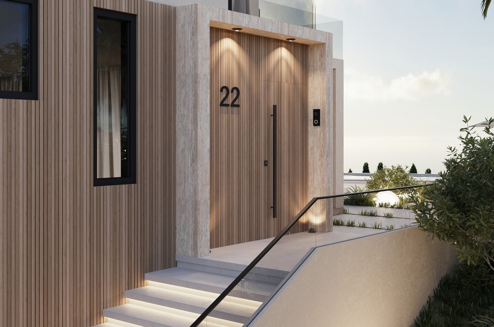 Modern entrance featuring a light wood door, the number 22, and illuminated steps.
