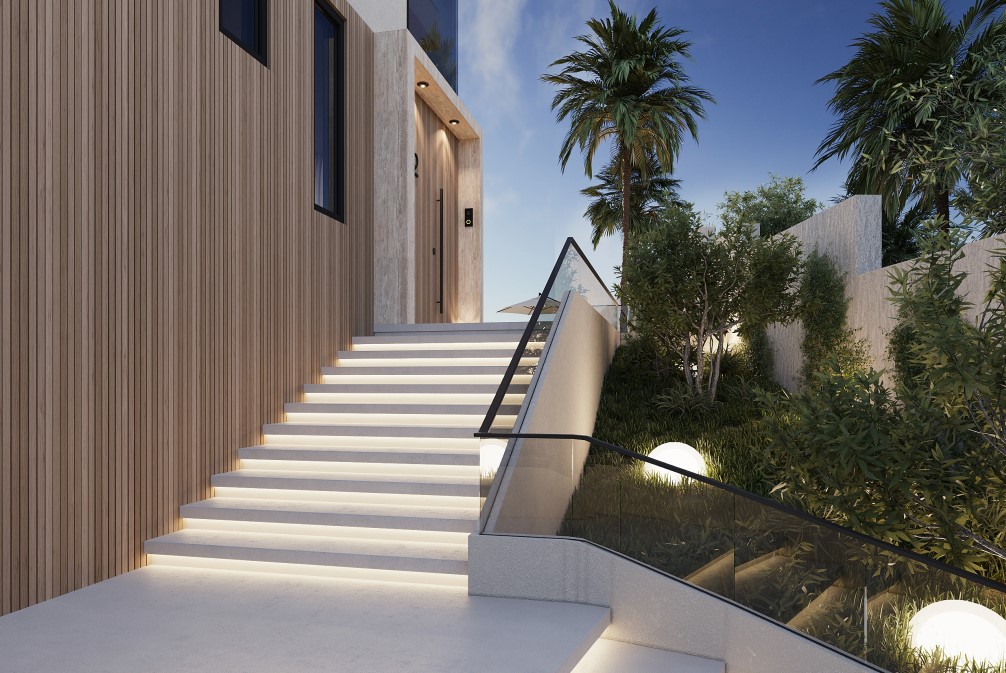 Modern entrance with illuminated stairs and vertical wood siding. Landscaped side garden with spherical lighting.