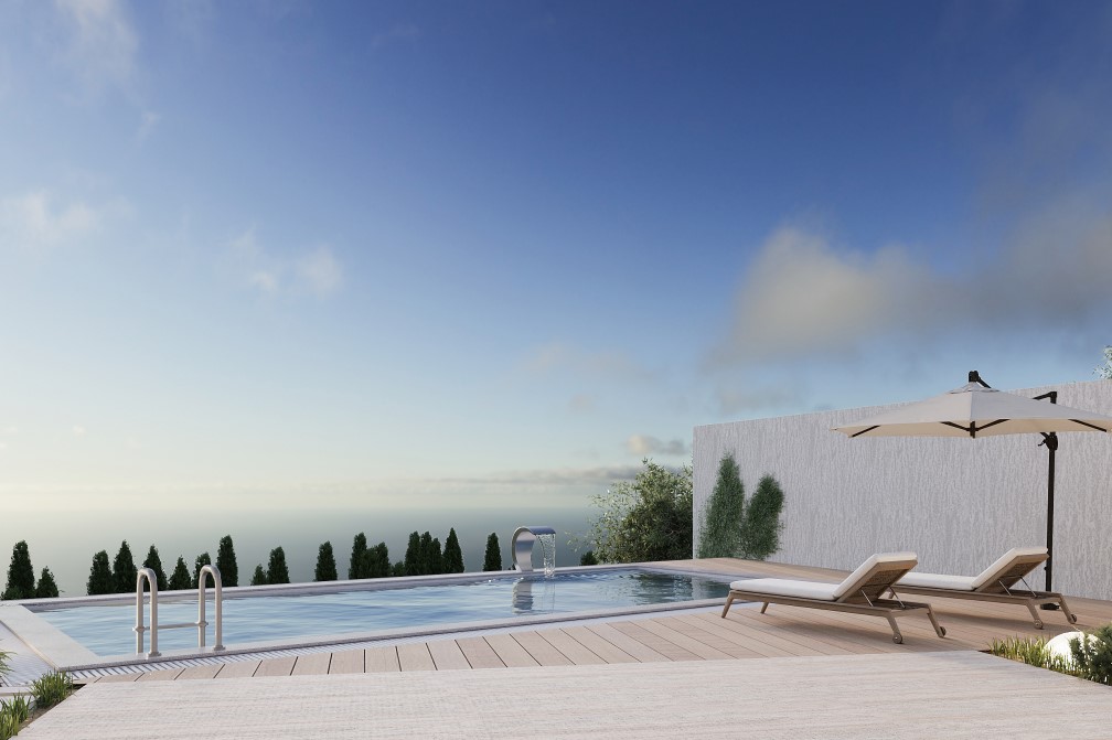 View of the private pool with waterfall feature and sun loungers, surrounded by greenery and sea views.