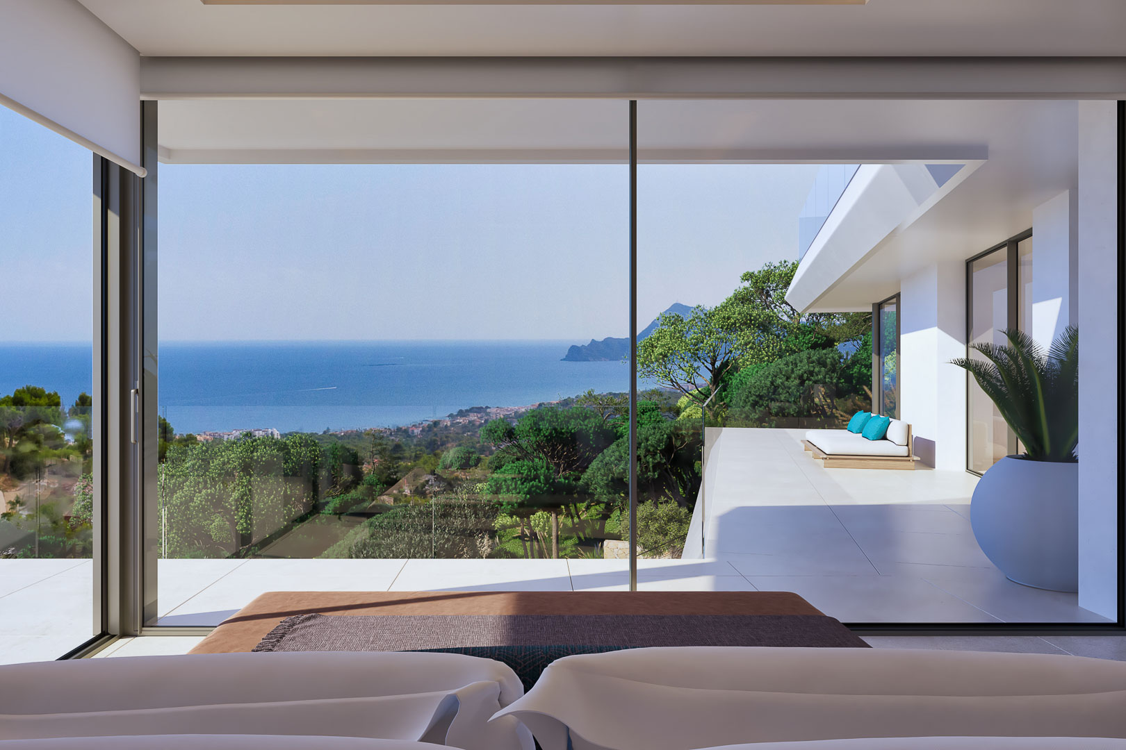 Master bedroom featuring floor-to-ceiling glass doors with panoramic Mediterranean views and a private terrace equipped with outdoor lounge seating and glass railings.