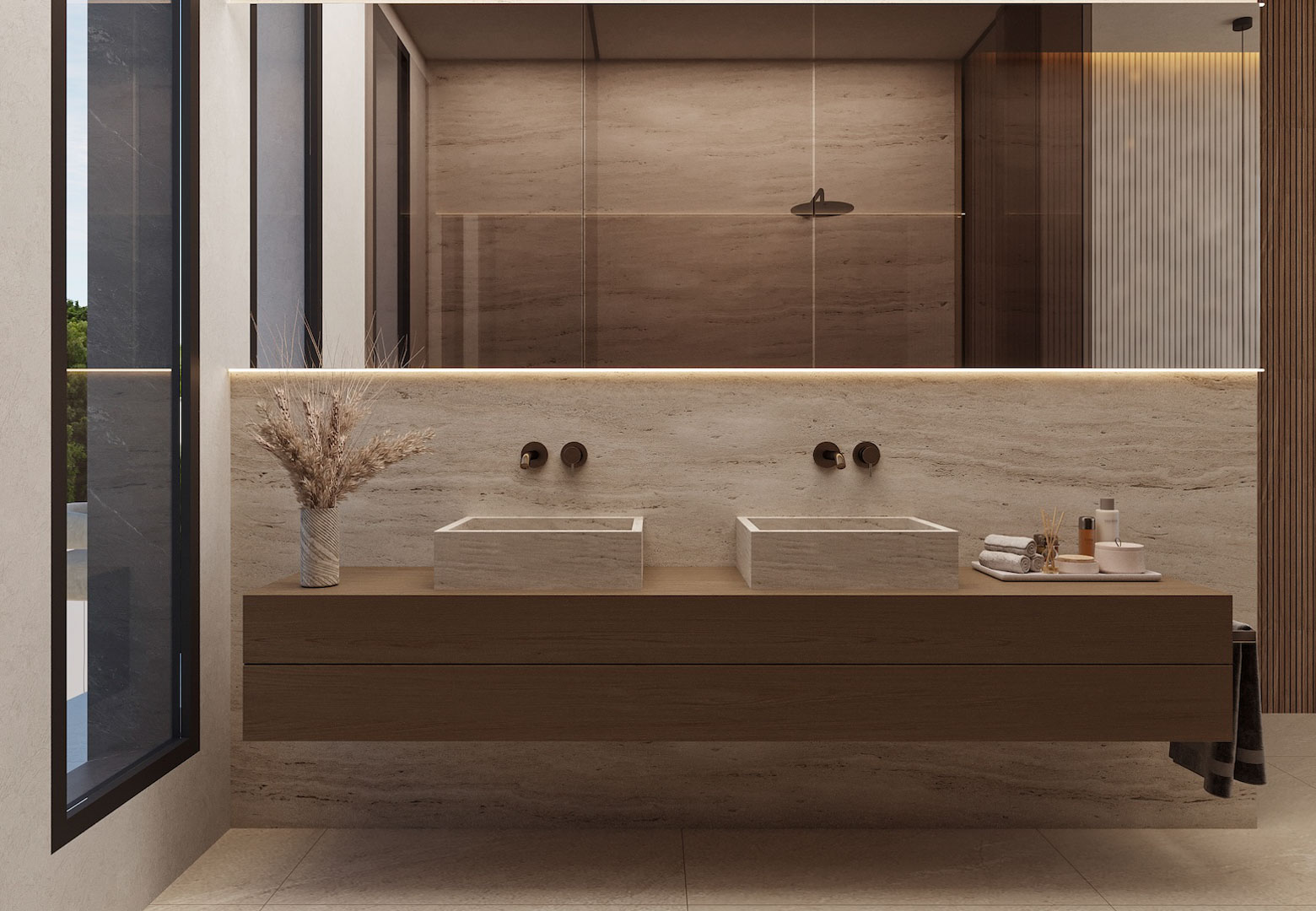 Modern bathroom featuring double stone vessel sinks on a floating wooden vanity. Highlights include wall-mounted fixtures, a large backlit mirror, and travertine wall cladding.