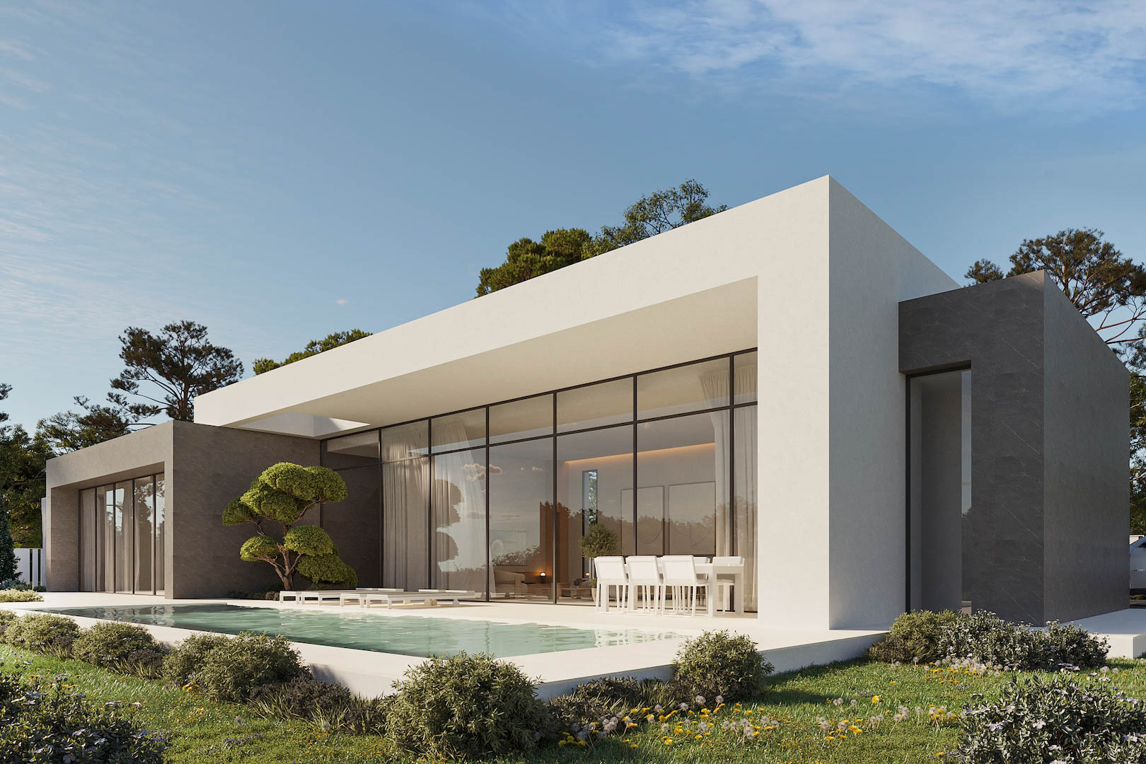 Modern single-story villa featuring floor-to-ceiling glass walls, a rectangular pool, and a shaded terrace with outdoor dining against white and grey stone facades.