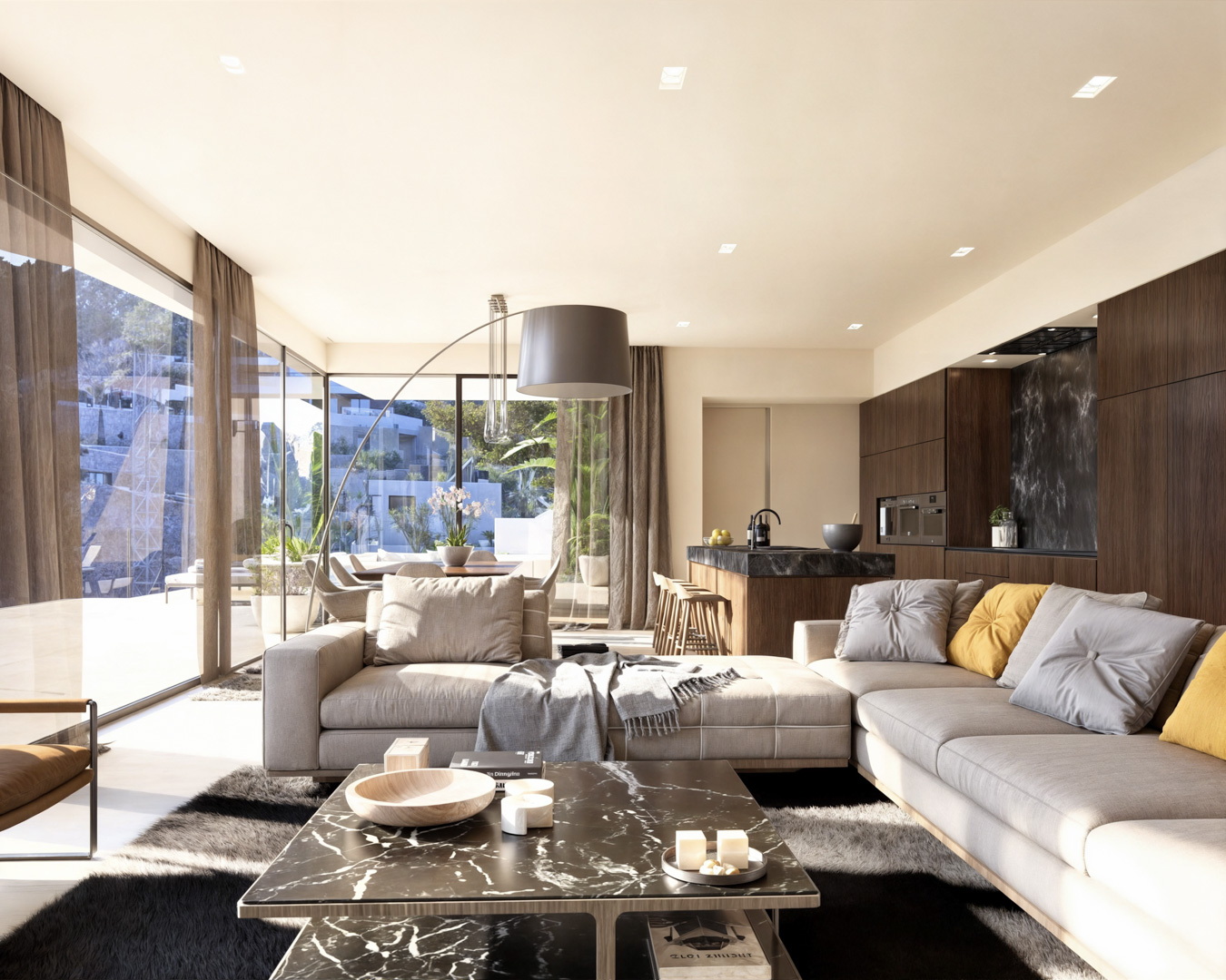 Open-plan living area featuring a modular sofa, black marble coffee table, and a designer kitchen with dark wood cabinetry and integrated appliances.