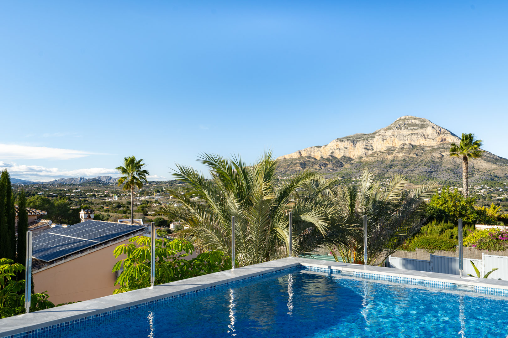 View of the blue-tiled pool with Montgó mountain in the background, Jávea.