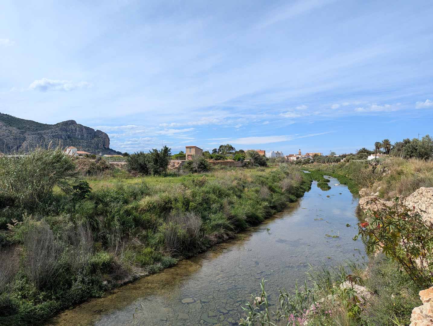 View of the natural surroundings featuring a river stream and the Segaria mountain range, highlighting the serene landscape near El Vergel.