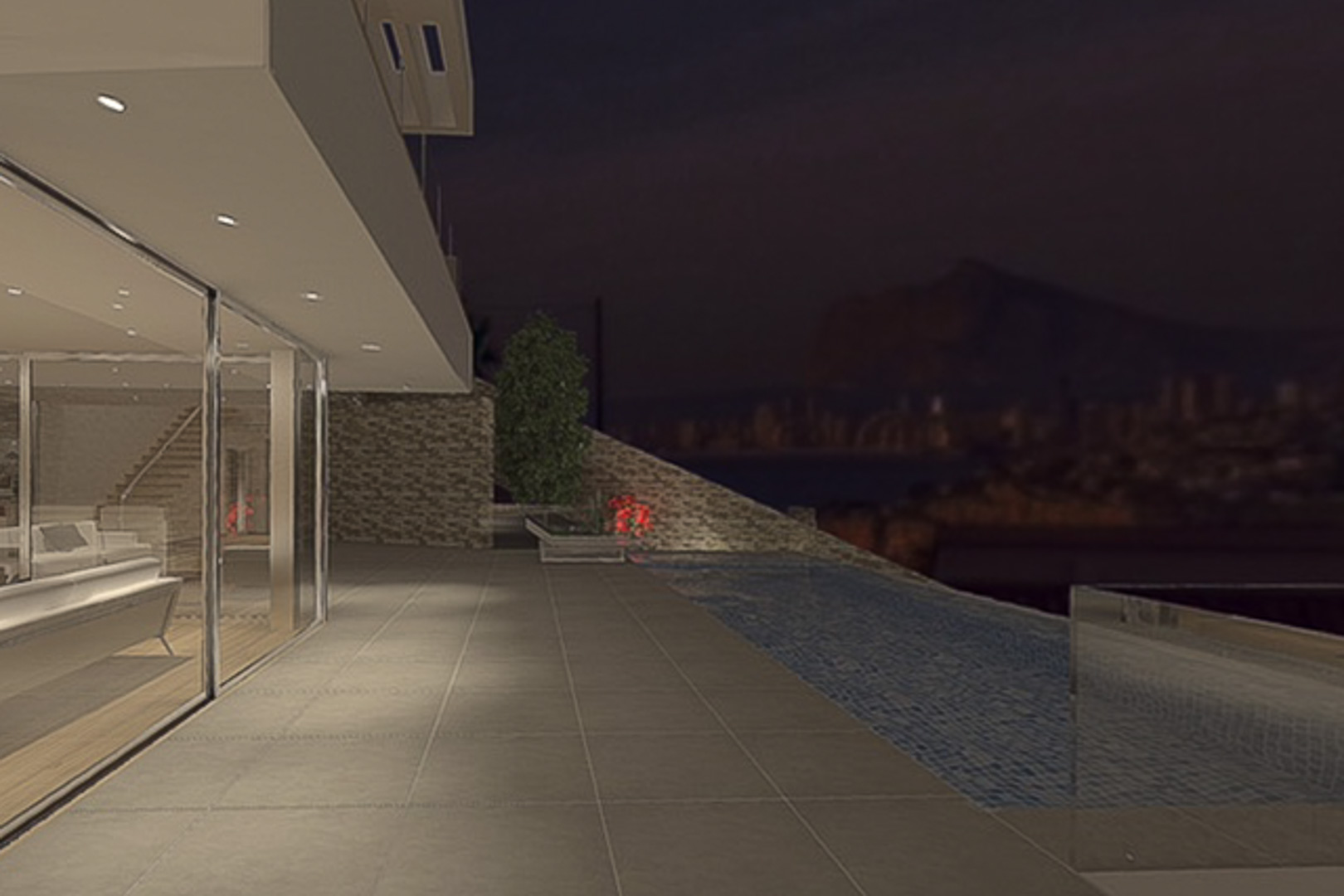 Nighttime terrace featuring an infinity pool and large-format tiling, seamlessly connected to the interior living space via floor-to-ceiling glass walls.