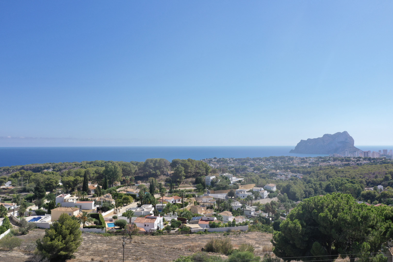 Panoramic views of the Mediterranean Sea and the Peñón de Ifach from the elevated plot location in the Racó de Galeno urbanization, Benissa.