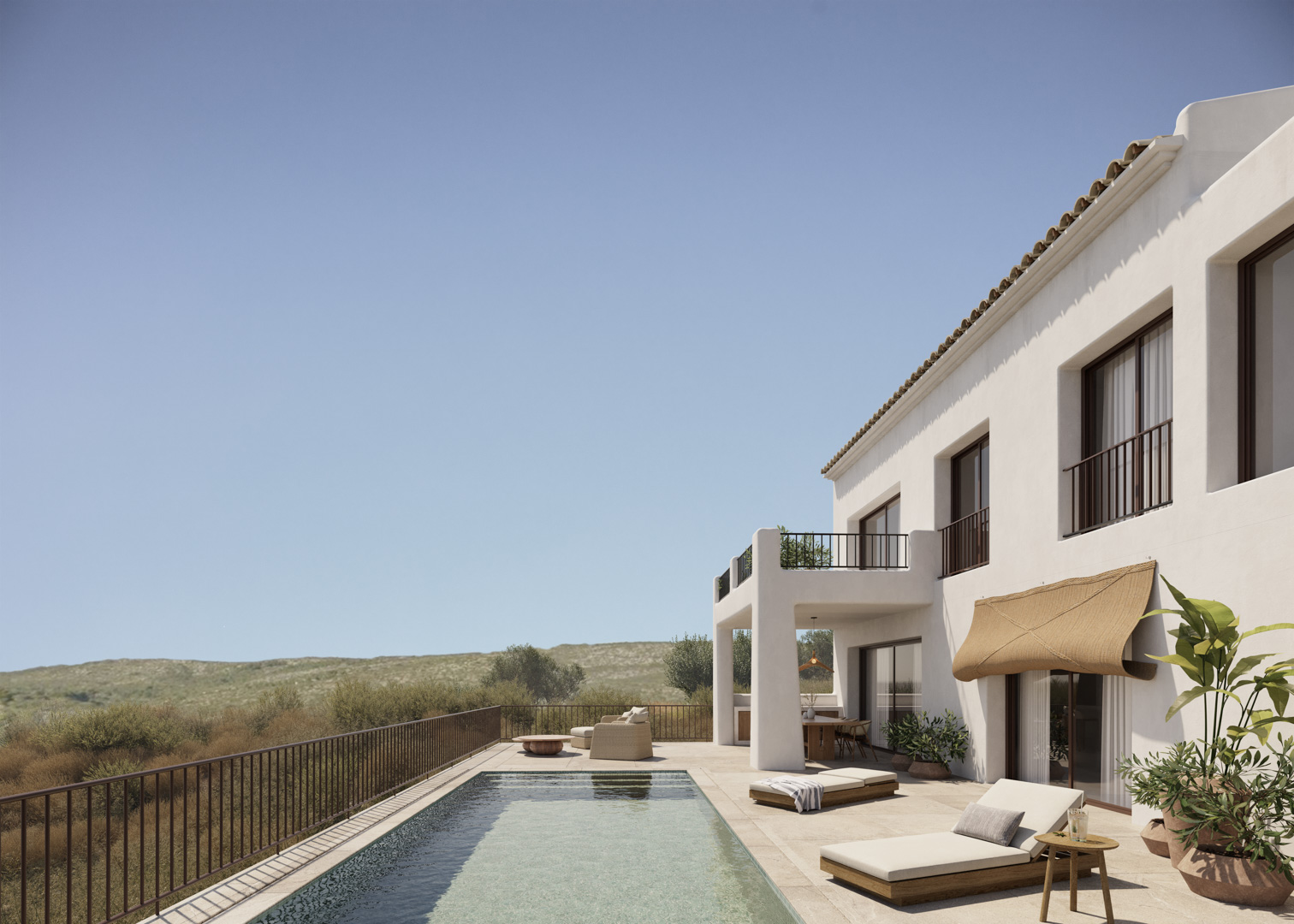 White Ibizan-style facade featuring a rectangular swimming pool, natural stone terrace, and outdoor lounge areas overlooking the scenic Jalón Valley.