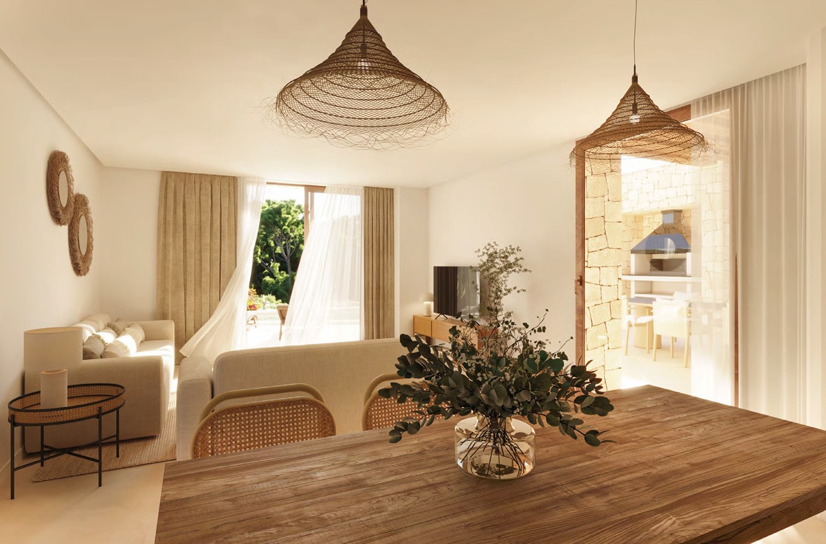 Bright dining area with rustic wood table and natural fiber pendant lights.