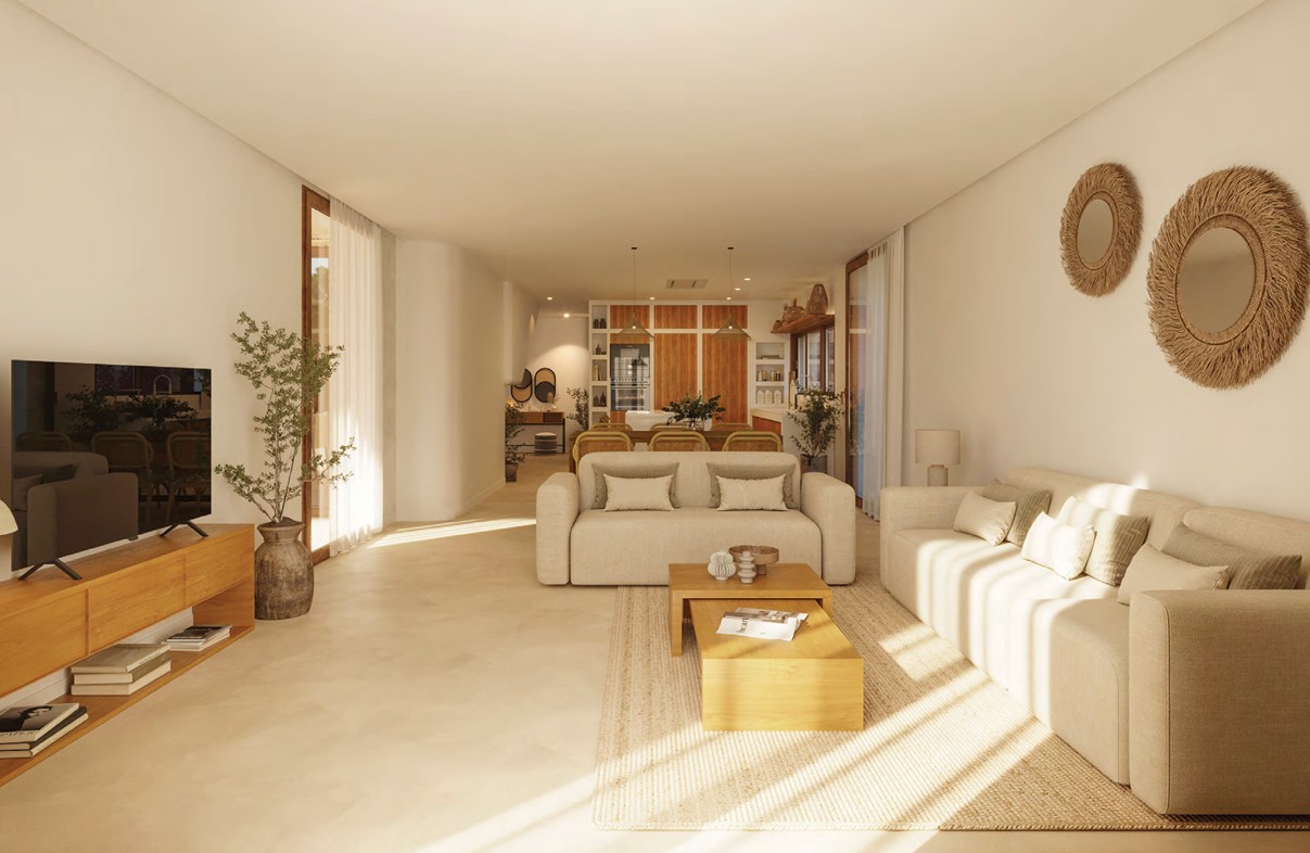 Bright living room featuring beige sofas, wood coffee table, and natural decor.