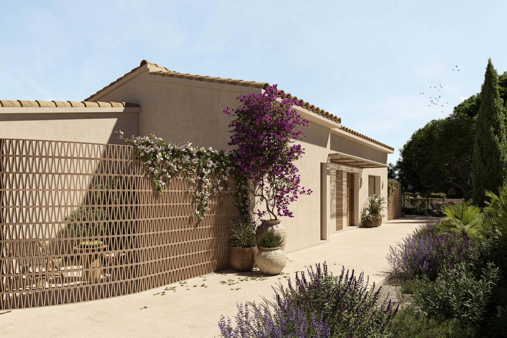 Mediterranean facade featuring decorative terracotta lattice, bougainvillea in clay pots, and a paved pathway bordered by native plants and lavender.