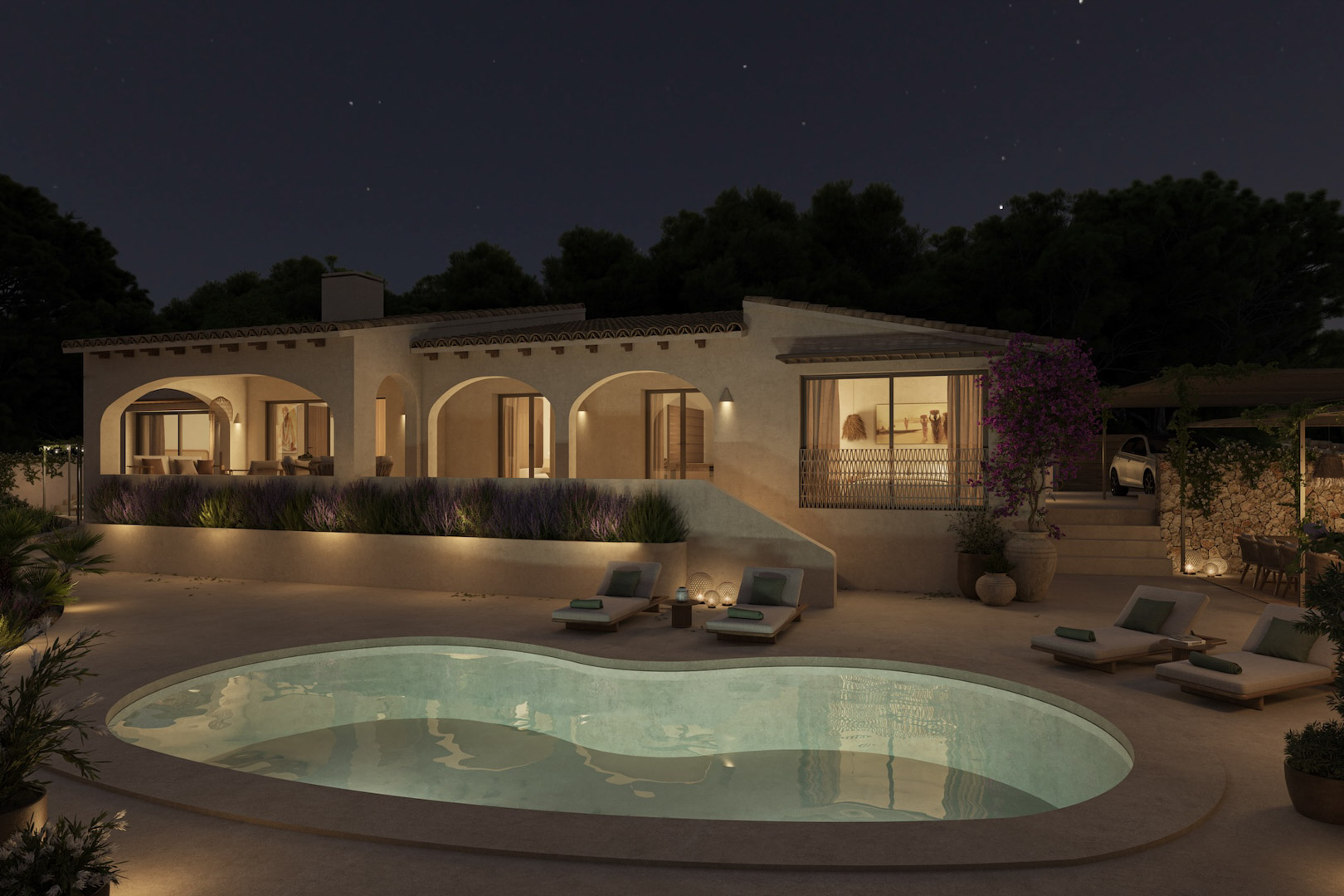 Night view of the villa featuring illuminated arched porches, an organic-shaped swimming pool, and a terrace with sun loungers set under a starry sky.